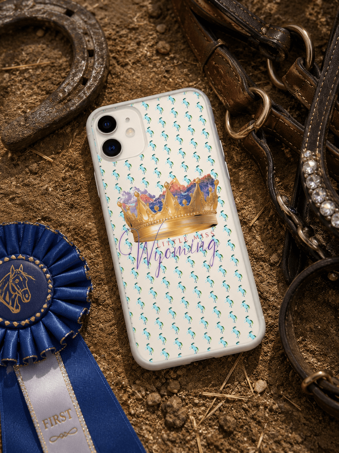 Little Miss Wyoming phone case with crown & horse pattern, styled with rodeo ribbon, horseshoe, and bridle