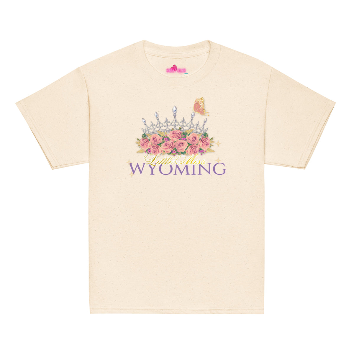 A cream-colored short-sleeve t-shirt with a graphic on the front featuring a crown, pink roses, a butterfly, and the text 'Wild West WYOMING'.